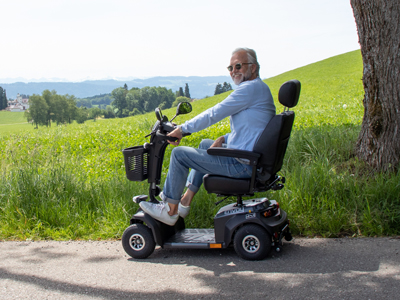 senior drives scooter